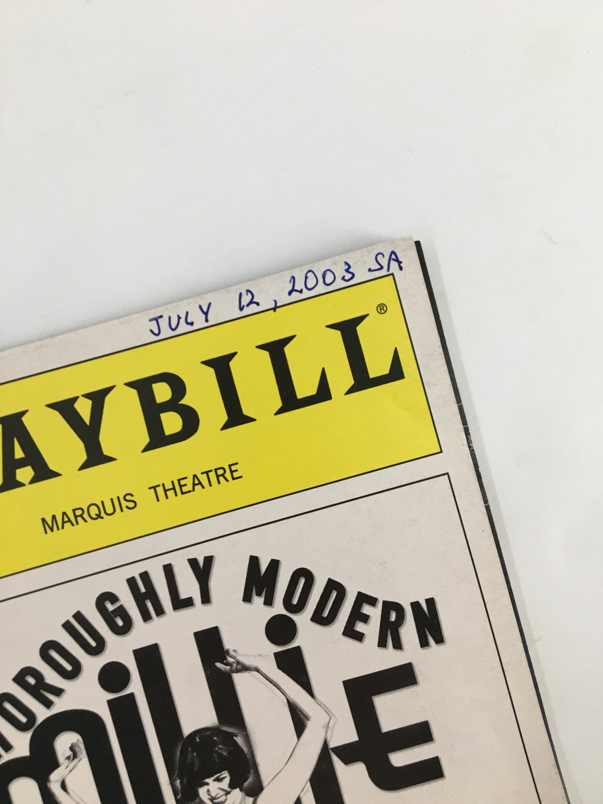 Detail shot of the 2003 Playbill featuring Whoopi Goldberg in Thoroughly Modern Millie, with the date 'July 12, 2003' written on the cover.