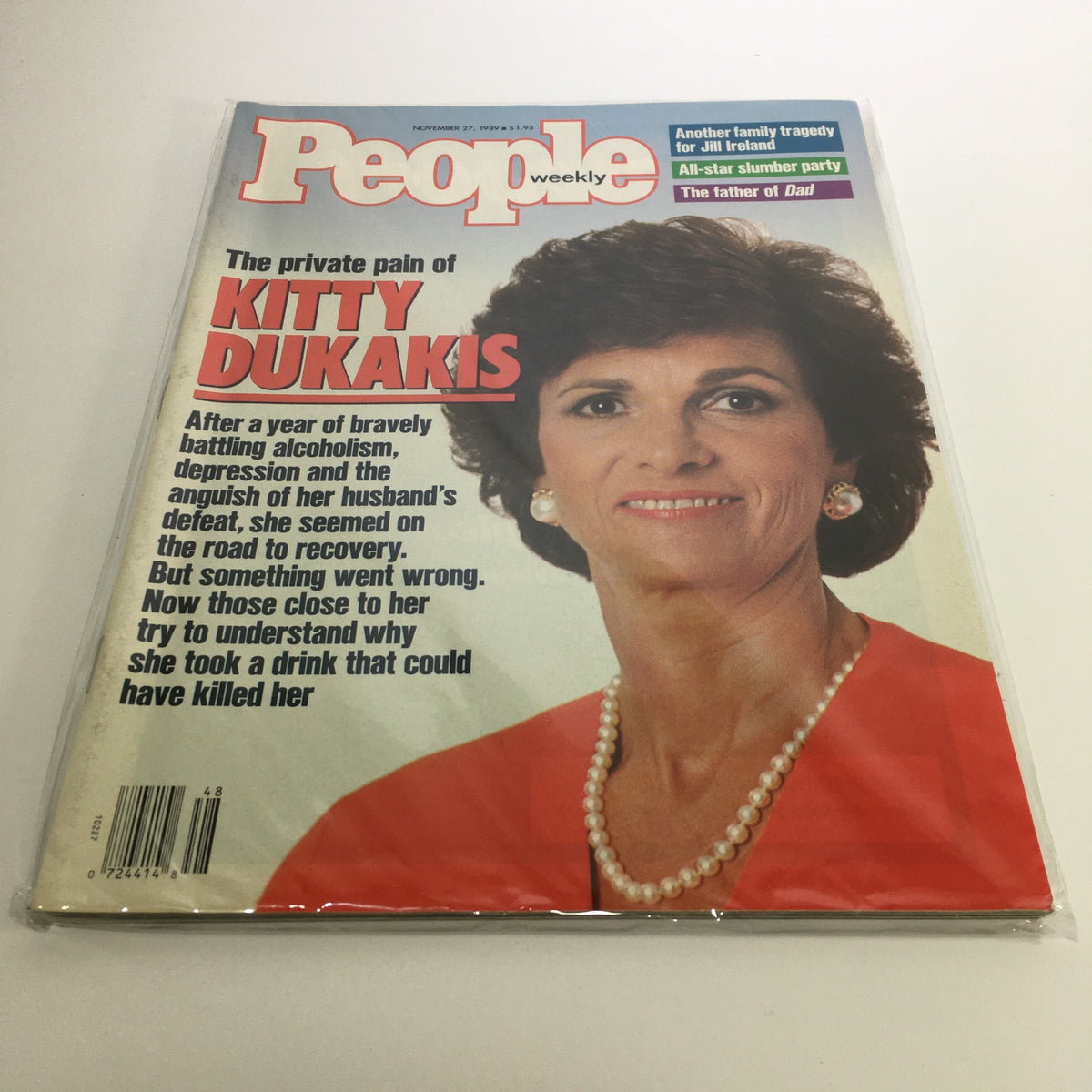 People Magazine November 27, 1989, featuring Kitty Dukakis, highlighting her candid discussion on battling alcoholism. The cover showcases her welcoming smile in a bright red outfit, emphasizing her personal journey and resilience.