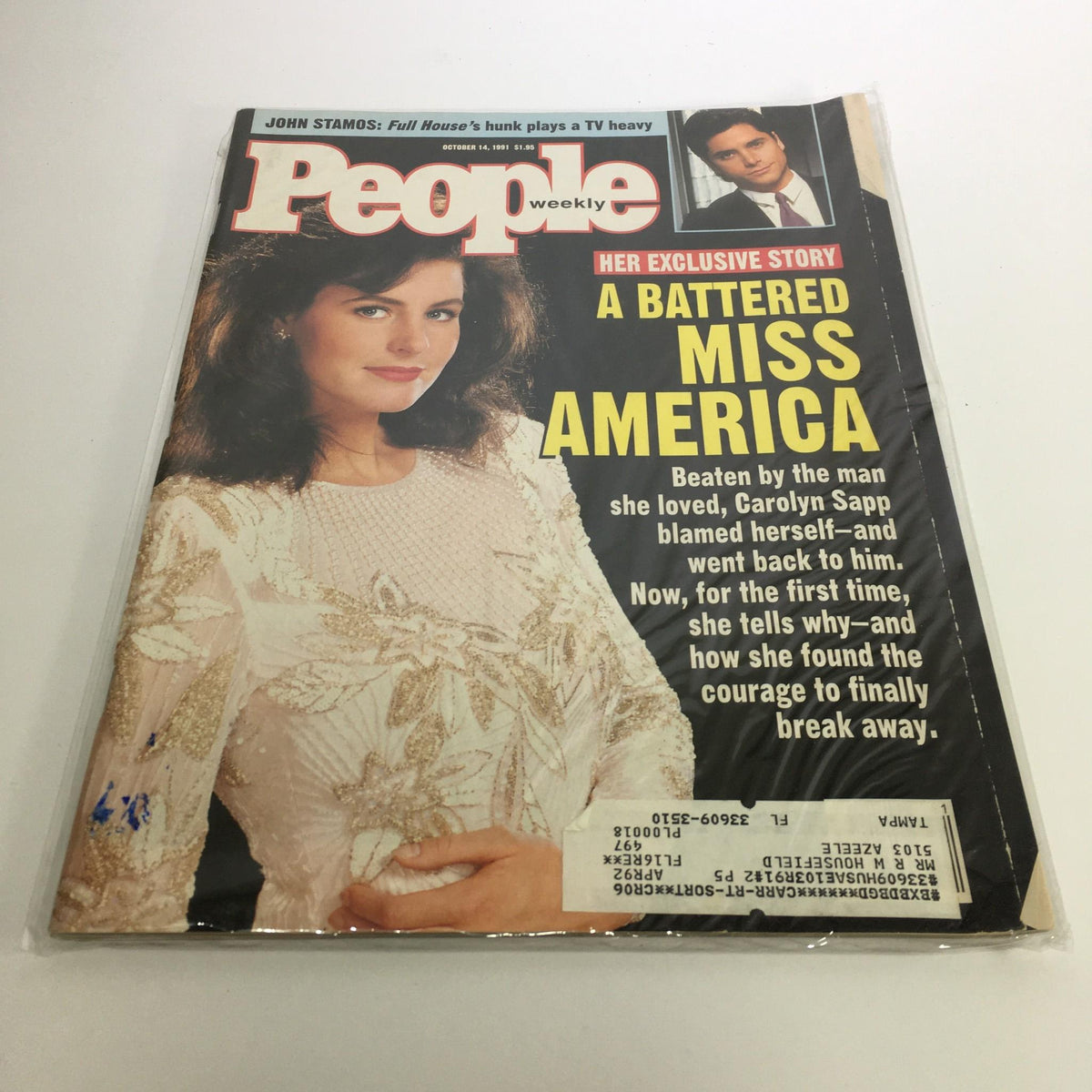 Cover of People Magazine from October 14, 1991 featuring an exclusive story titled 'A Battered Miss America' highlighting Carolyn Sapp. The image shows Carolyn Sapp in a beautiful cream-colored gown, set against a black background with bold text describing her experiences.