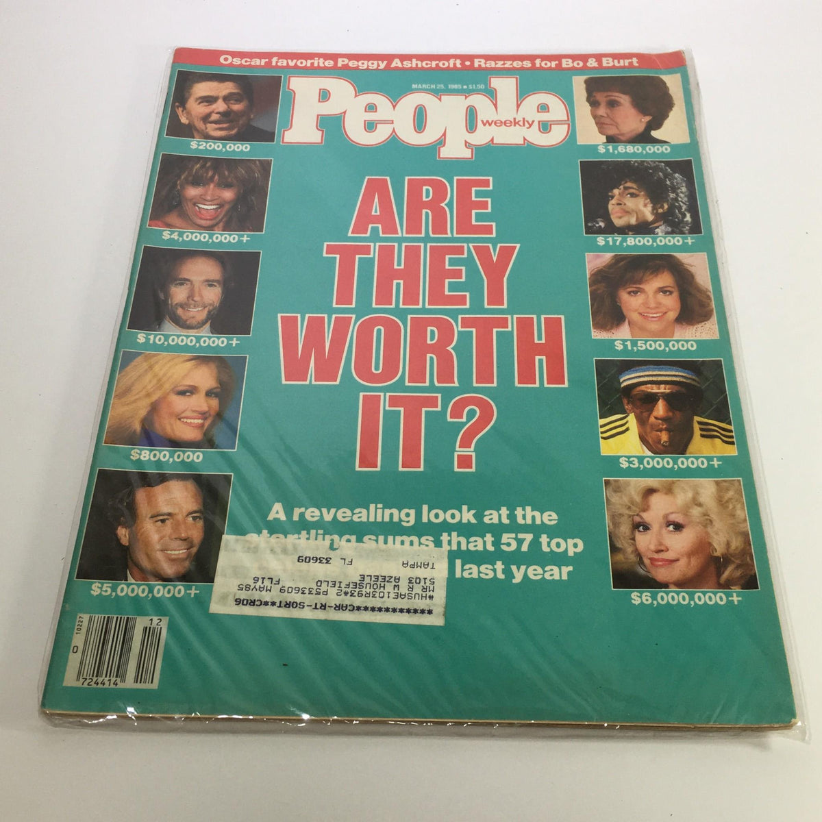 People Magazine cover from March 25, 1985 featuring the title 'Peggy Ashcroft is the Oscar's Favorite'. The cover displays images of various celebrities alongside monetary figures, highlighting their worth. The magazine is in good condition with minor wear, protected in plastic wrap. Ideal for collectors of vintage magazines.