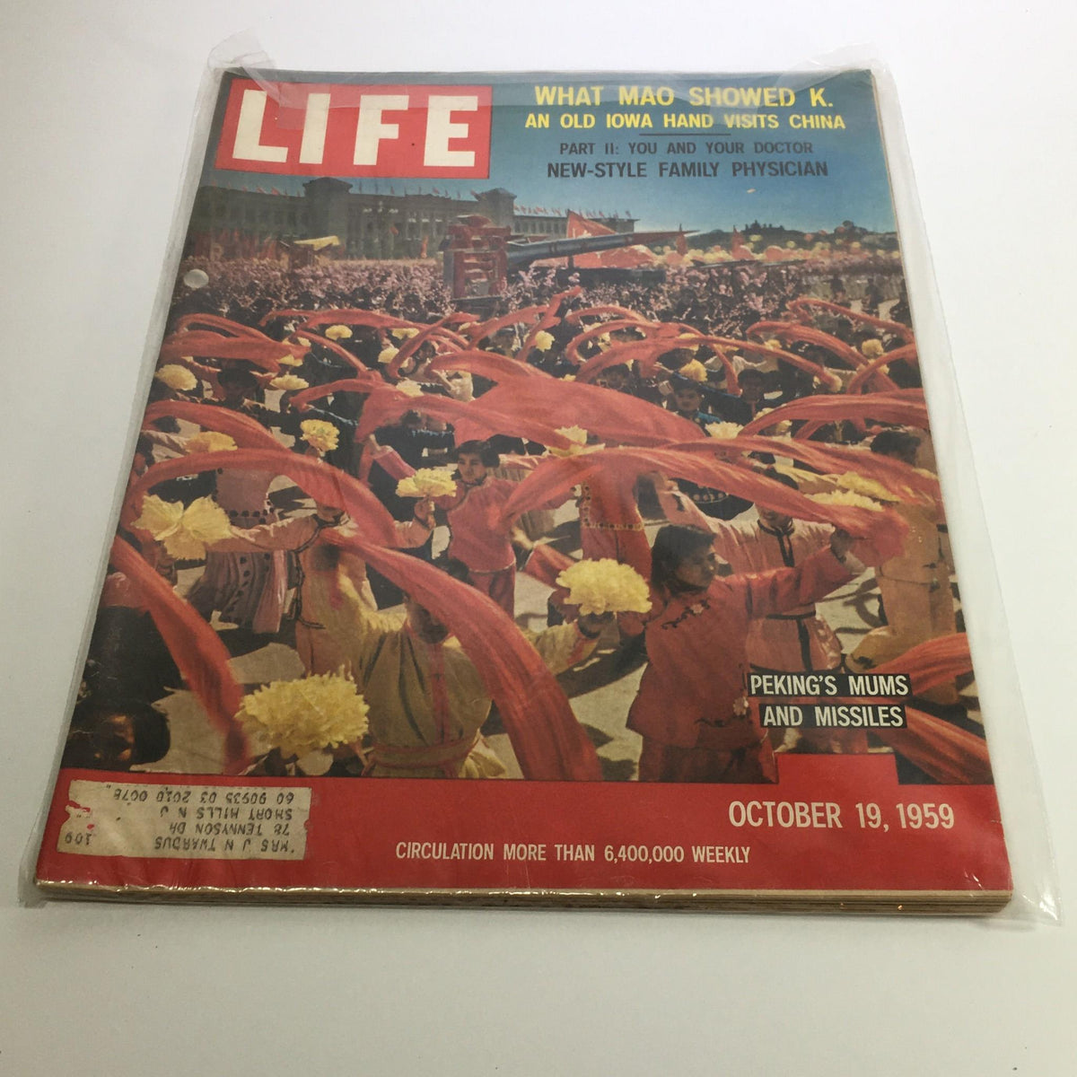 Cover of Life Magazine dated October 19, 1959, featuring the title 'What Mao Showed K. An Old Iowa Hand Visits China'. The cover depicts a vibrant scene of performers holding yellow flowers, dressed in colorful outfits with red ribbons, showcasing a cultural celebration in China during the late 1950s.