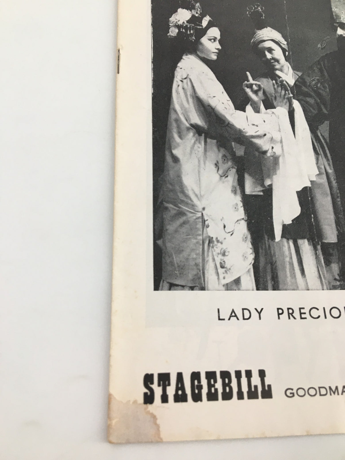 Close-up view of the 1958 Stagebill for Lady Precious Stream, showcasing detailed imagery and historical significance at Goodman Memorial Theatre.