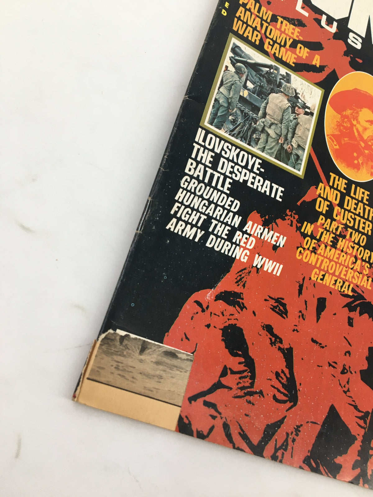 Close-up of the binding of VTG Combat Illustrated Magazine August 1976, showcasing its vintage wear and unique features highlighting military history.
