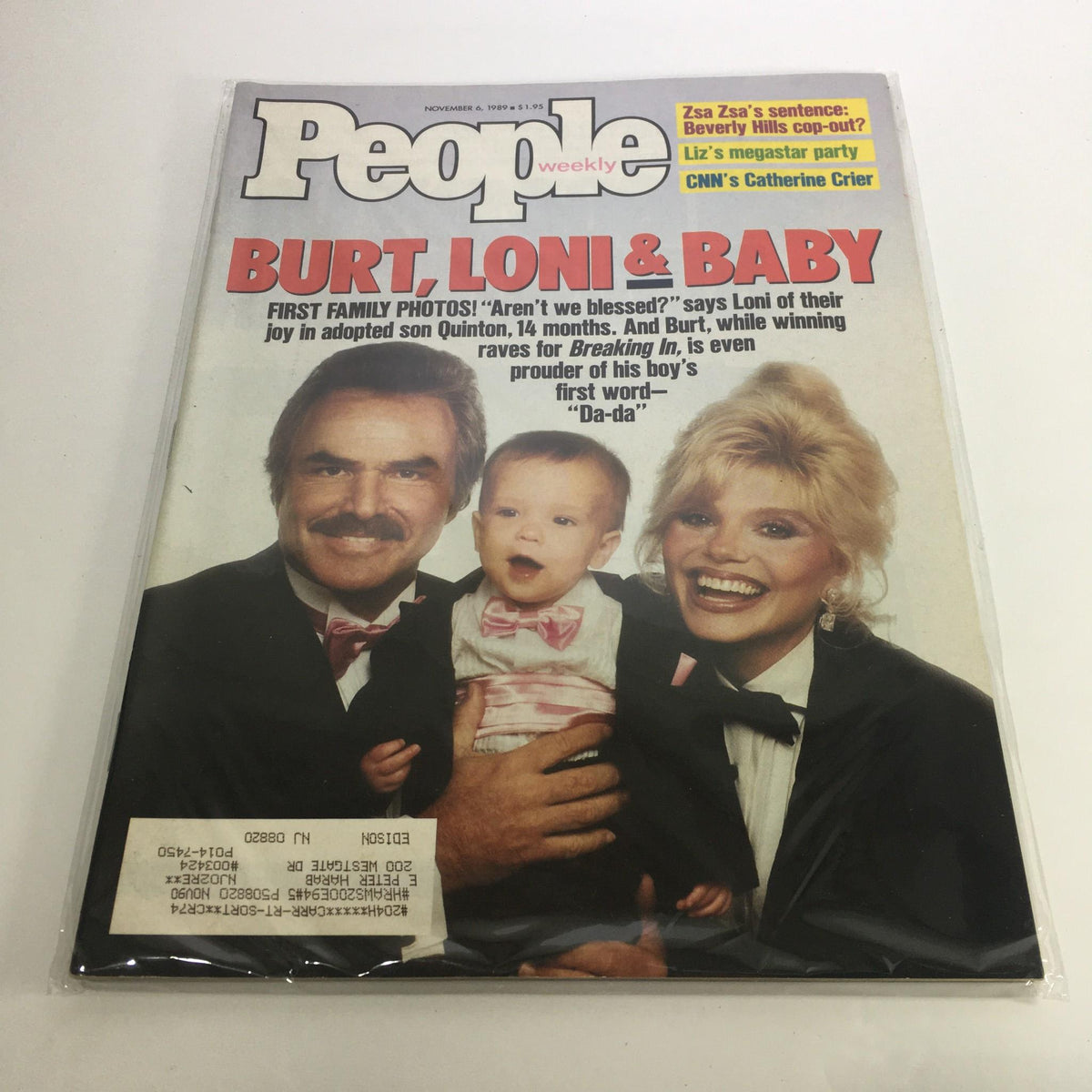 Cover of People Magazine from November 6, 1989, featuring a family portrait of Burt Reynolds, Loni Anderson, and their adopted baby Quinton. This vintage magazine highlights their joy as a family, capturing a moment in Hollywood history.