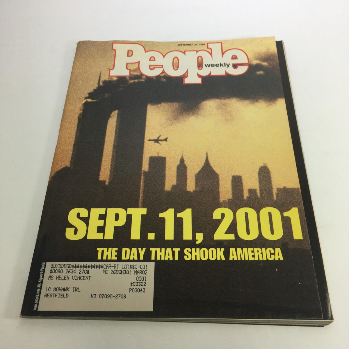 People Magazine September 24, 2001 issue featuring the cover titled 'The Day That Shook America', highlighting the September 11, 2001 events with a dramatic image of the Twin Towers and an airplane in the background.