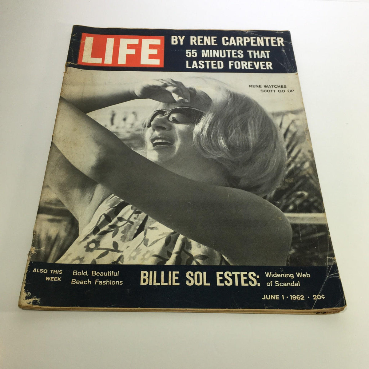 Cover of Life Magazine dated June 1, 1962 featuring the title 'Life by Rene Carpenter: 55 Minutes That Lasted Forever'. The magazine displays a photograph of a woman in sunglasses, joyfully shielding her eyes from the sun, alongside intriguing articles including 'Billie Sol Estes: Widening Web of Scandal' and a note about 'Bold, Beautiful Beach Fashions'.