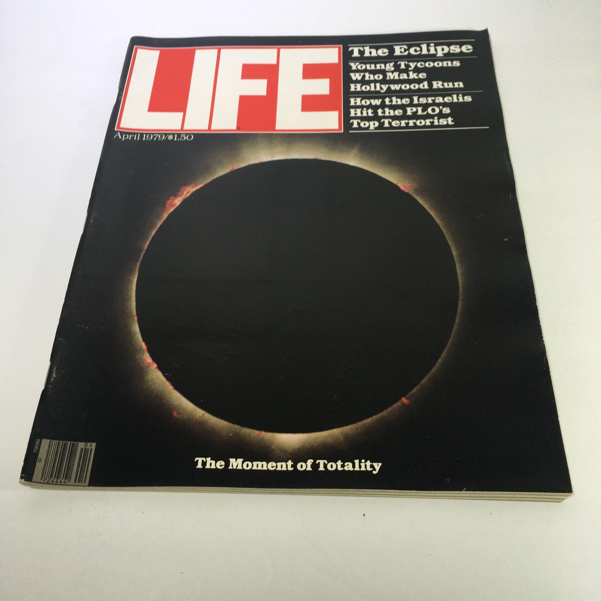 Cover of Life Magazine: April 1979 - The Eclipse: The Moment of Totality showcasing the total solar eclipse with a dark silhouette against a colorful halo.