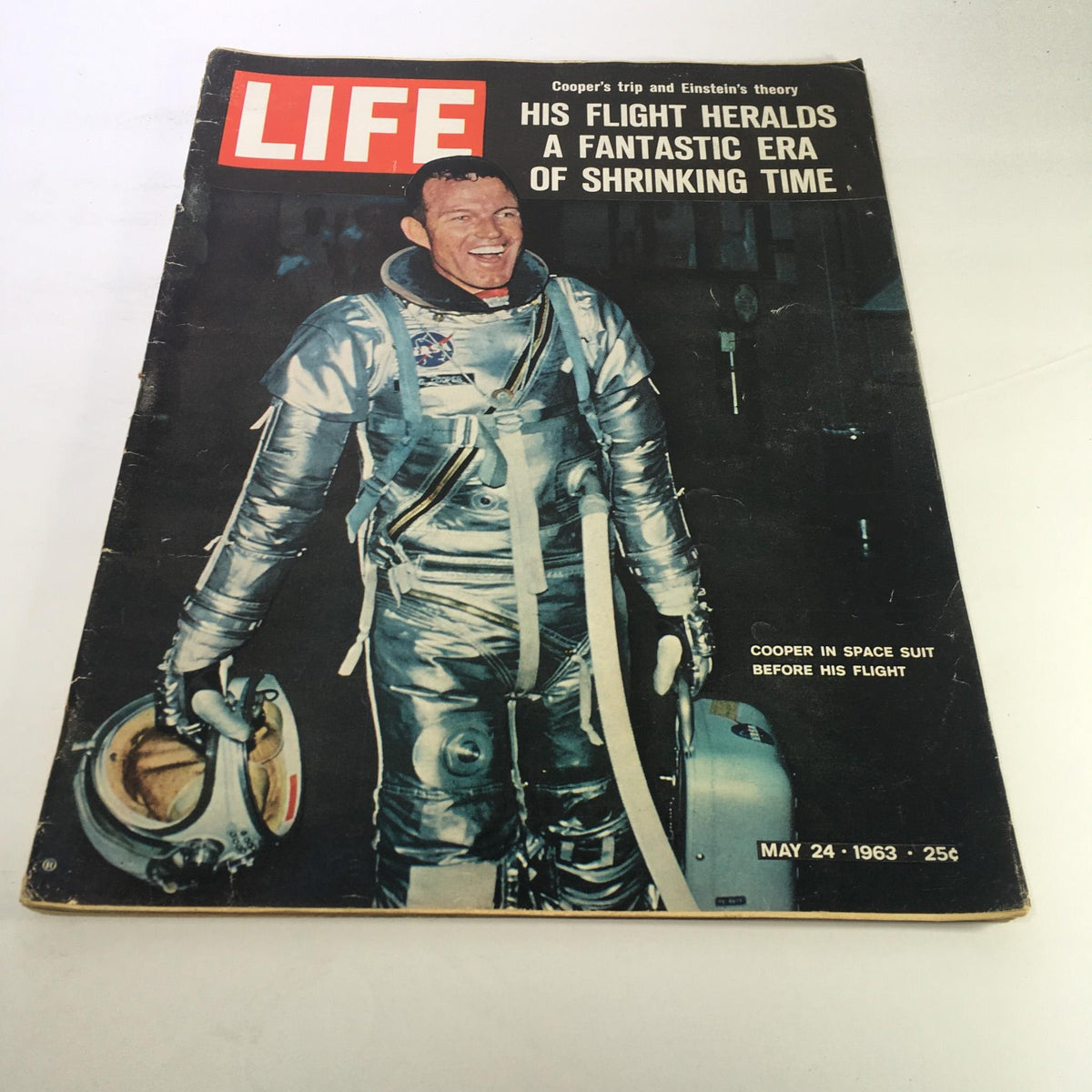 Cover of Life Magazine dated May 24, 1963, featuring astronaut Cooper in a silver space suit, with the headline discussing Cooper's trip and Einstein's theory, capturing a pivotal moment in space exploration.