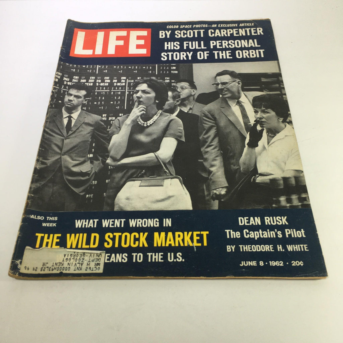 Cover of Life Magazine from June 8, 1962, featuring the title 'What Went Wrong in The Wild Stock Market'. The magazine includes a black and white photograph of a group of people in a stock market setting, discussing investment challenges during the economic climate of the early 1960s.