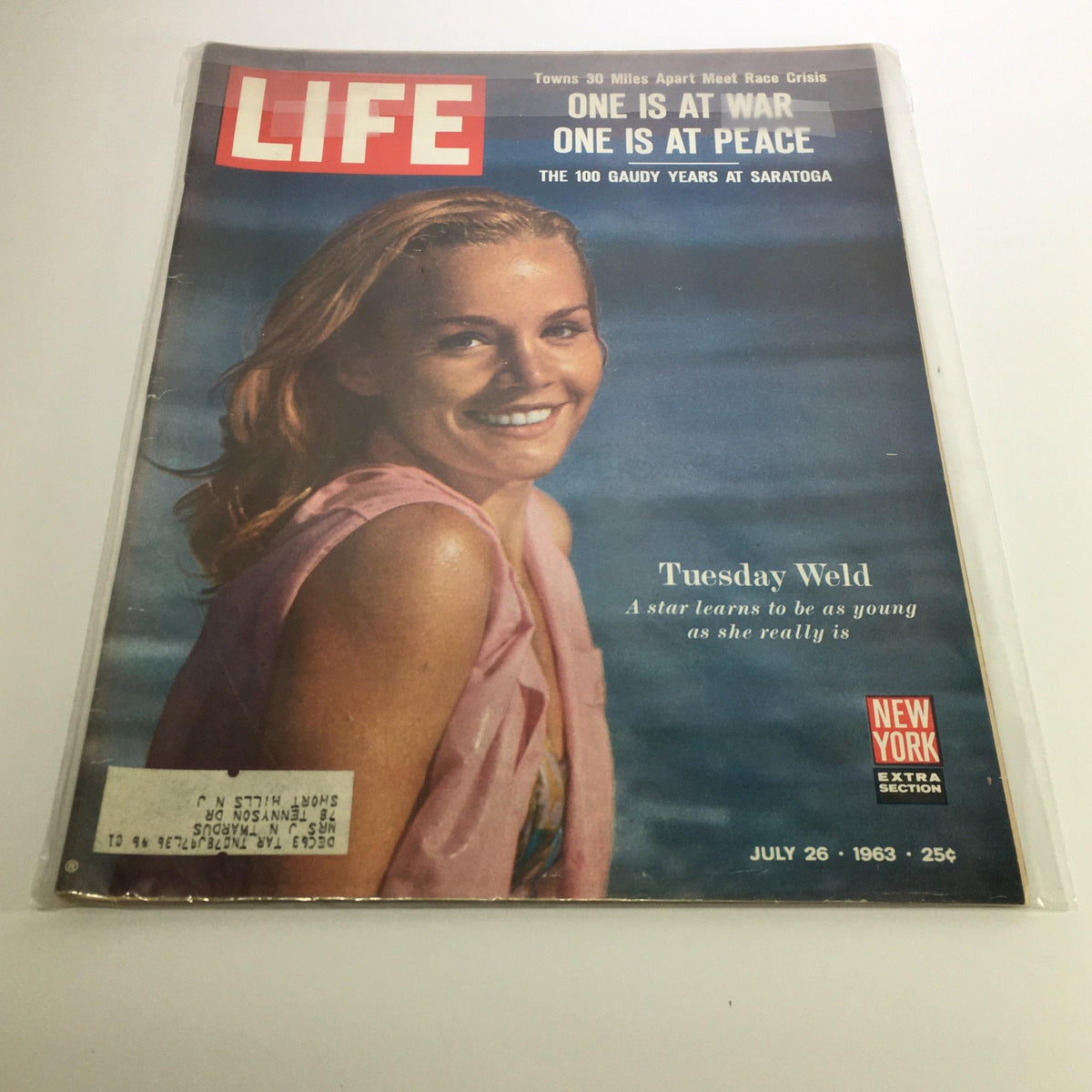 Cover of Life Magazine from July 26, 1963 featuring actress Tuesday Weld, highlighting the article 'One is at War, One is at Peace' and showcasing a vintage design.