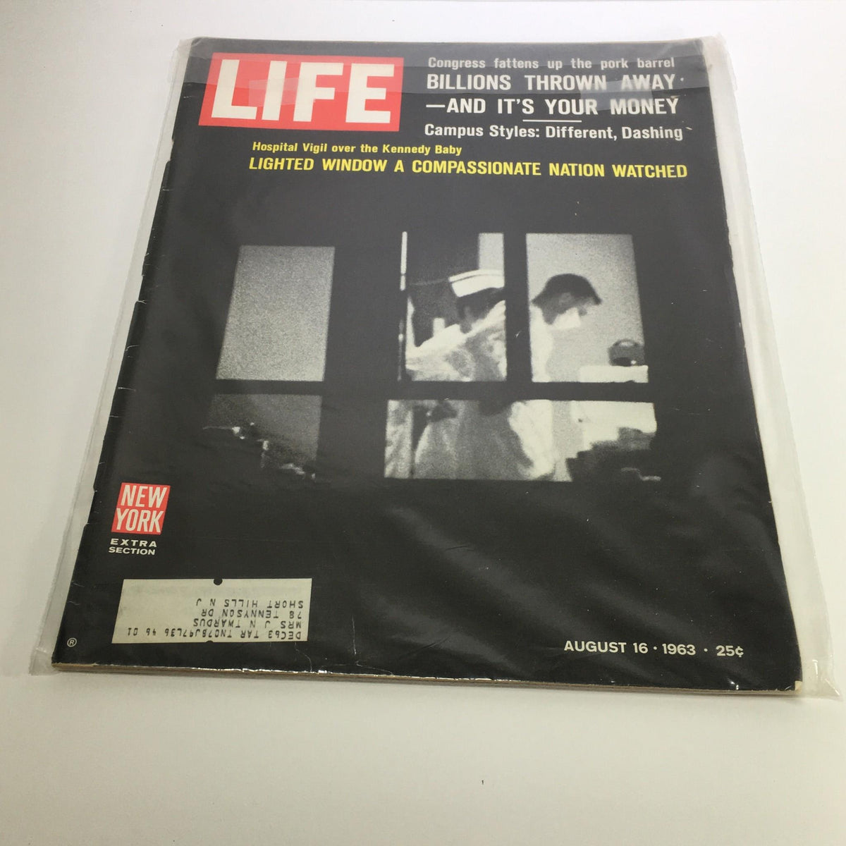 Cover of Life Magazine from August 16, 1963, featuring the title 'Hospital Vigil over the Kennedy Baby'. The magazine showcases a black and white image of medical personnel at a hospital, surrounded by a plastic wrapper for preservation. Ideal for collectors of vintage magazines and those interested in American history.