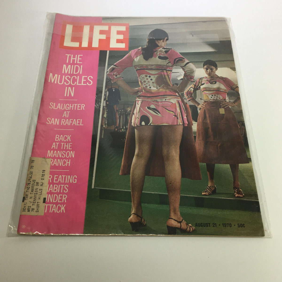 Cover of Life Magazine from August 21, 1970 featuring the title 'The Midi Muscles In & Slaughter at San Rafael'. The cover showcases two women trying on fashionable outfits, highlighting the trends of the 1970s, with a vintage aesthetic.