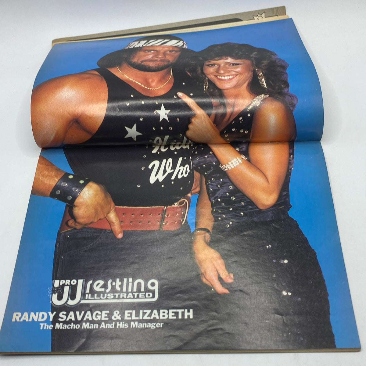 Inside spread of Pro Wrestling Illustrated Magazine February 1987 highlighting Randy Savage and Elizabeth, showcasing their significance in wrestling history.