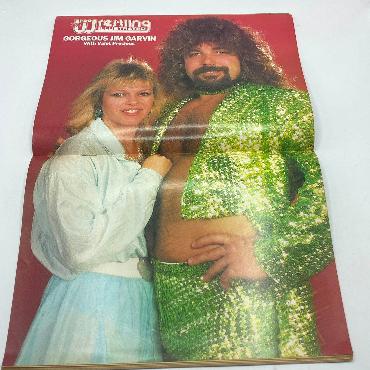 Pro Wrestling Illustrated Magazine August 1987 featuring Gorgeous Jim Garvin with Valet Precious, showcasing a vibrant cover design.
