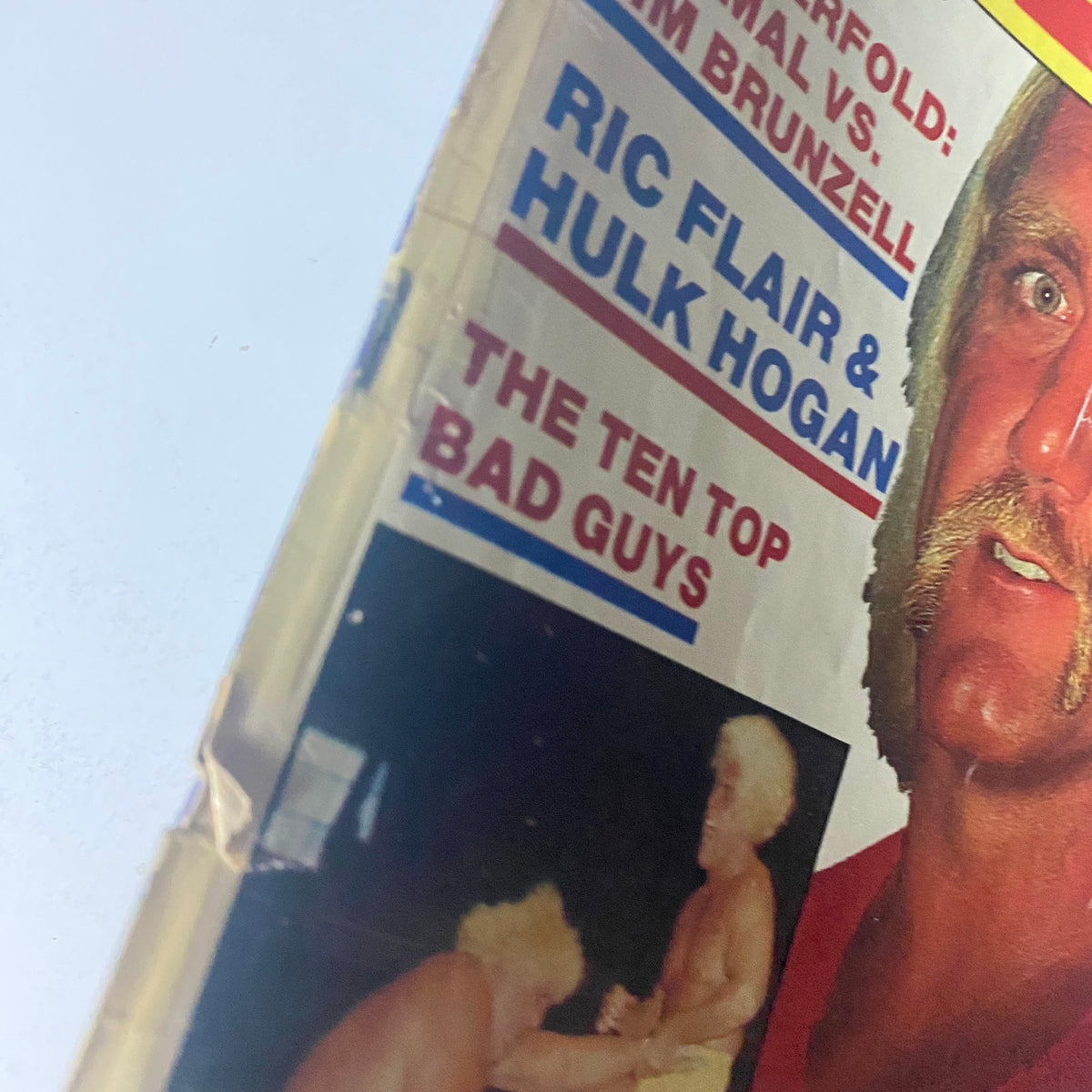 Close-up of Wrestling Eye Magazine November 1985 cover highlighting Hulk Hogan and Ric Flair, with details on featured matches and wrestlers, emphasizing its vintage wrestling collectible appeal.