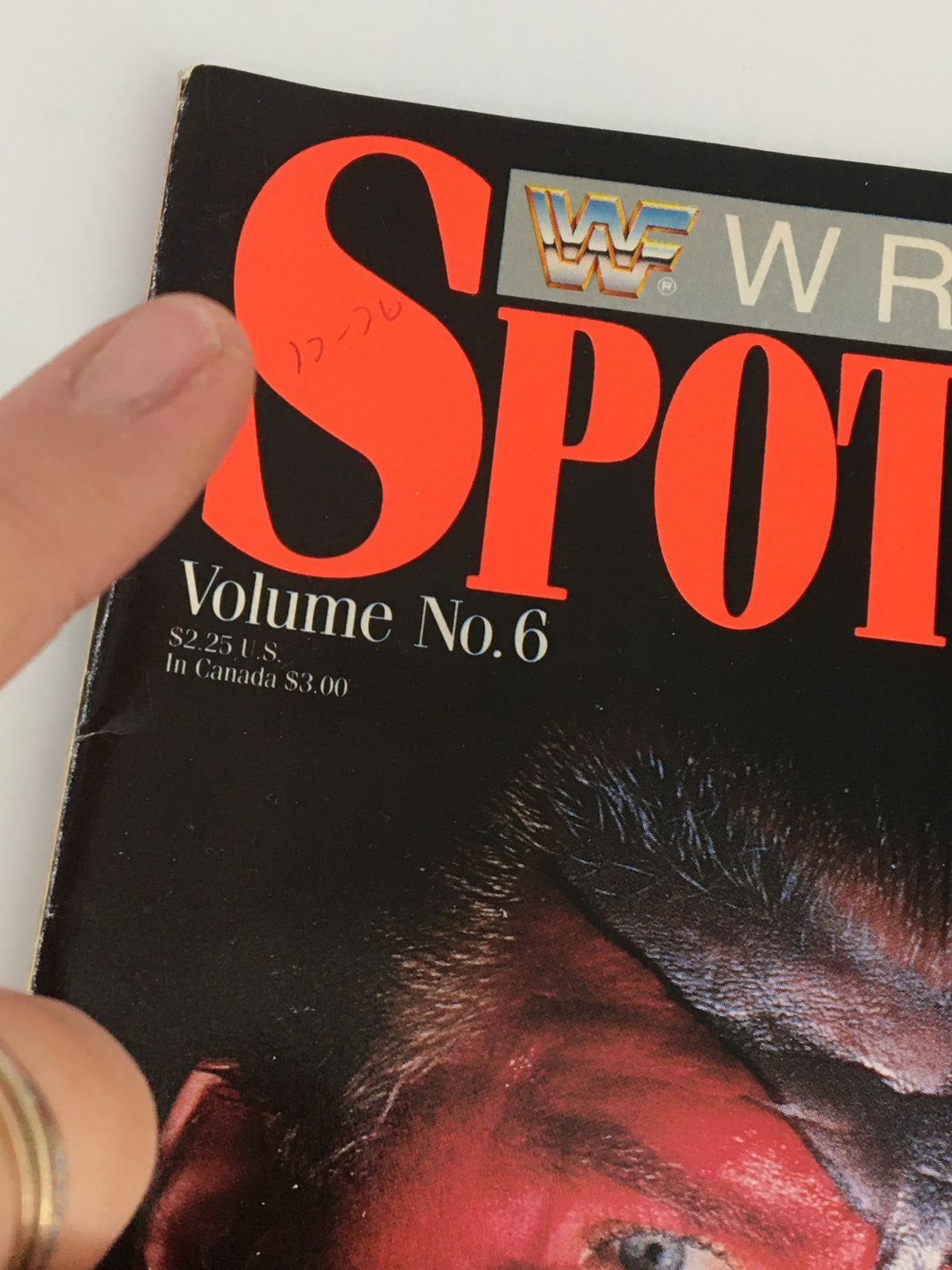 Close-up of the top corner of Vintage WWF Wrestling Spotlight Magazine Volume 6, highlighting the title and price details.