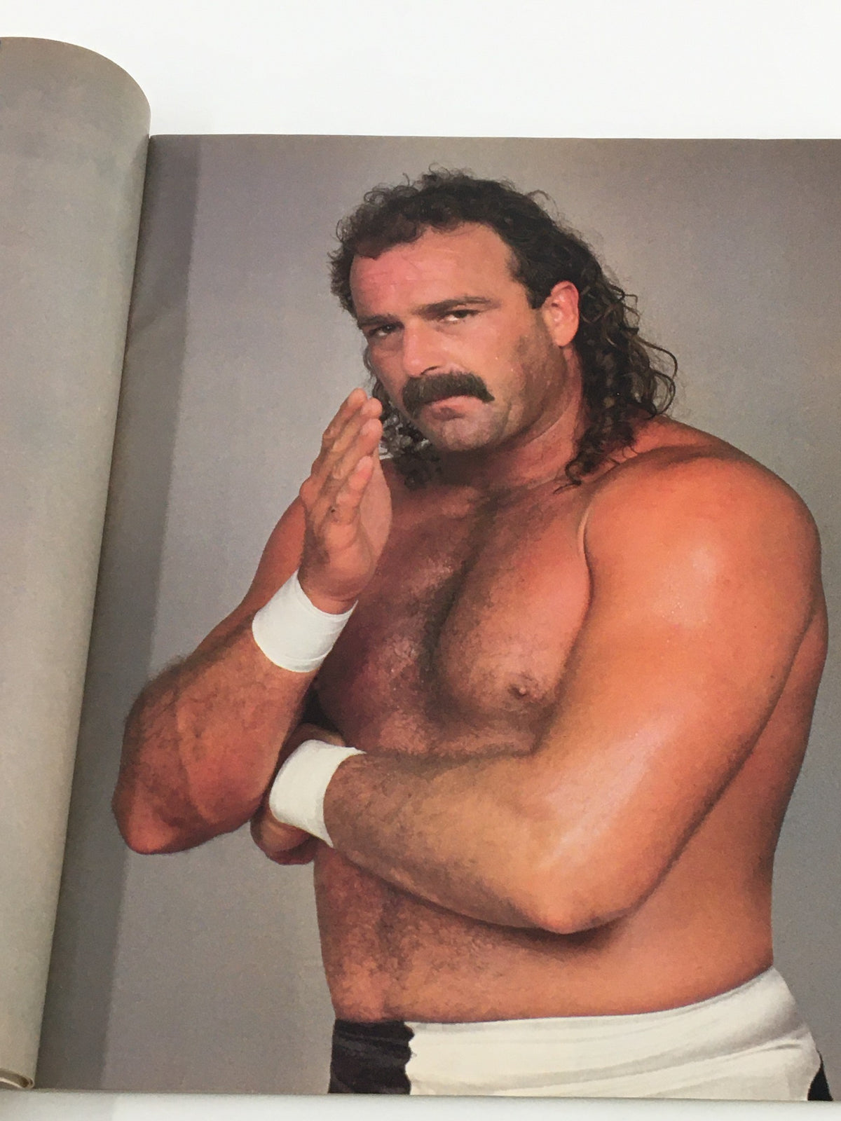 Image from WWF Magazine September 1988 of Jake The Snake Roberts posing, capturing a moment from the iconic wrestling era, a valuable piece for collectors.