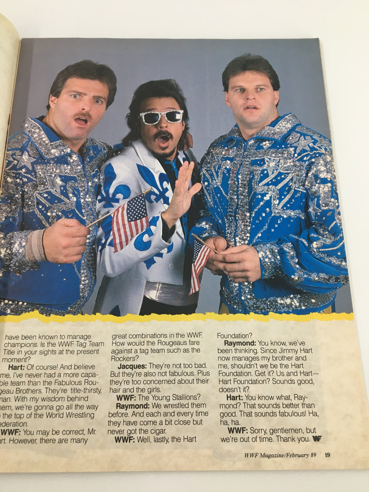 WWF Magazine February 1989 showcasing the Rougeo Brothers in a playful pose, essential figures in the world of wrestling.