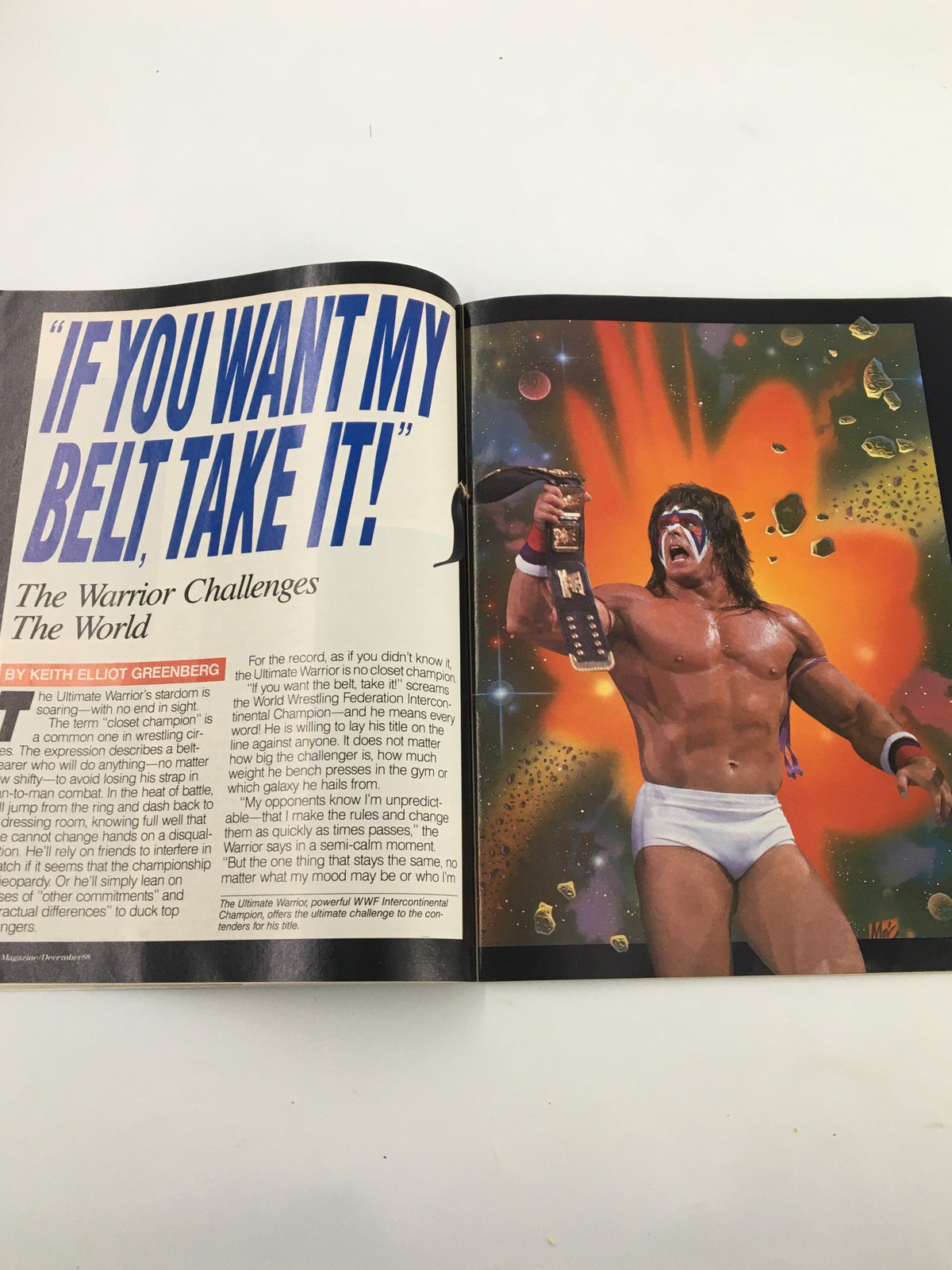 Colorful page from VTG WWF Magazine December 1988 featuring the Ultimate Warrior with the belt, challenging contenders in a dynamic illustration.