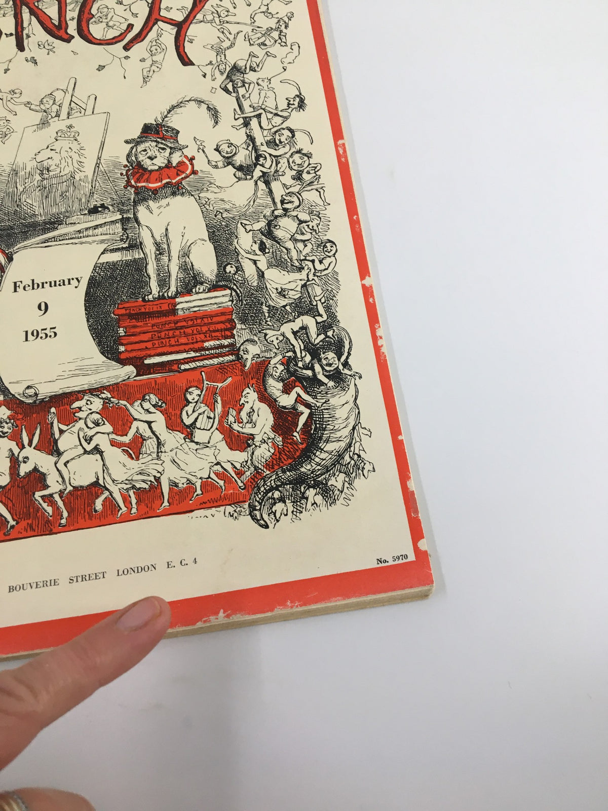 Detailed view of the corner of VTG Punch February 9 1955 WWII Cartoon & Humour Magazine, showcasing the publication's title and artistic illustrations.