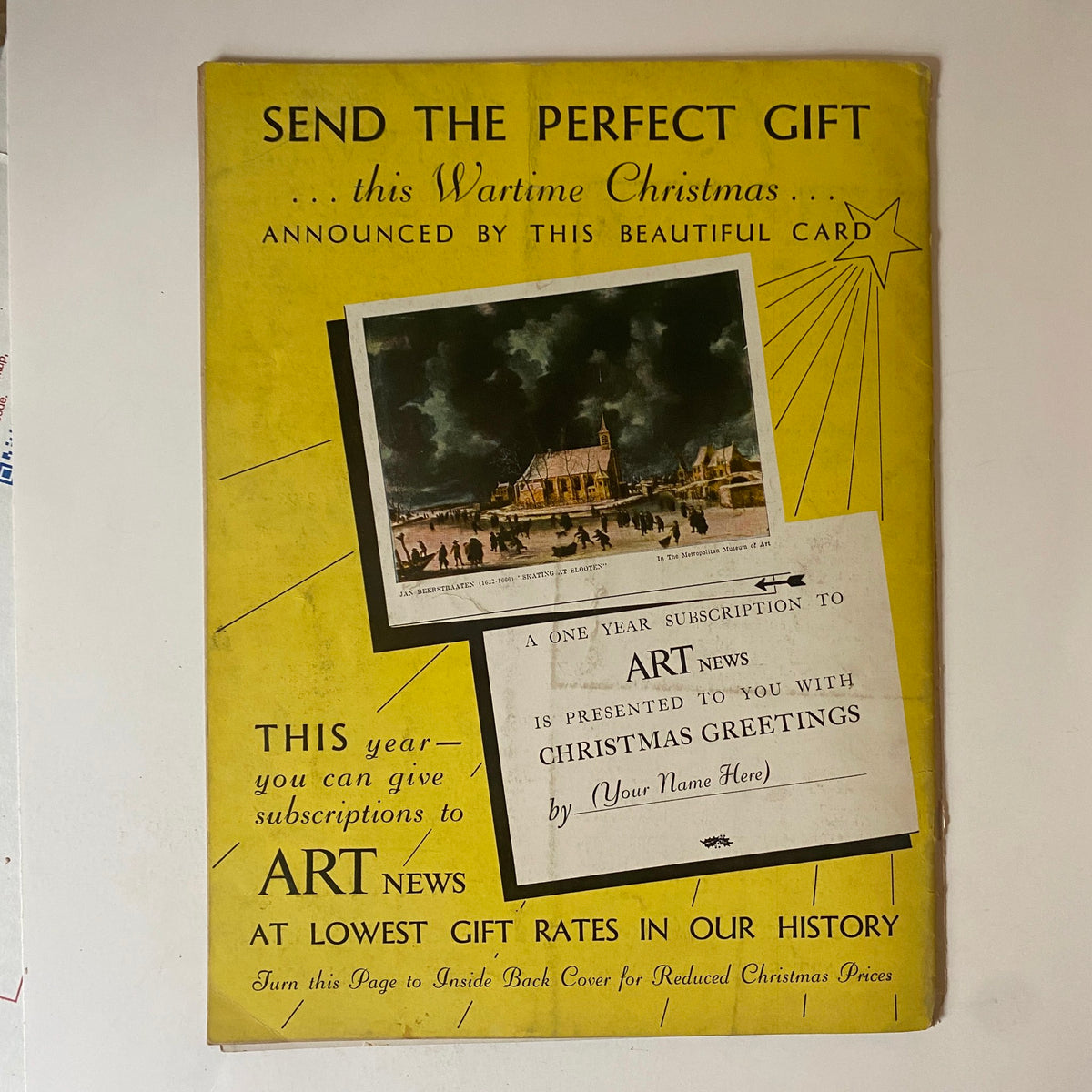 Vintage advertisement card promoting subscriptions to Art News, highlighting a wartime Christmas theme. The card features a beautiful illustration and text stating 'SEND THE PERFECT GIFT' and 'A ONE YEAR SUBSCRIPTION to ART News is PRESENTED TO YOU WITH CHRISTMAS GREETINGS.' This image relates to the VTG Art News Magazine December 1-14, 1942 and captures the spirit of art during World War II.