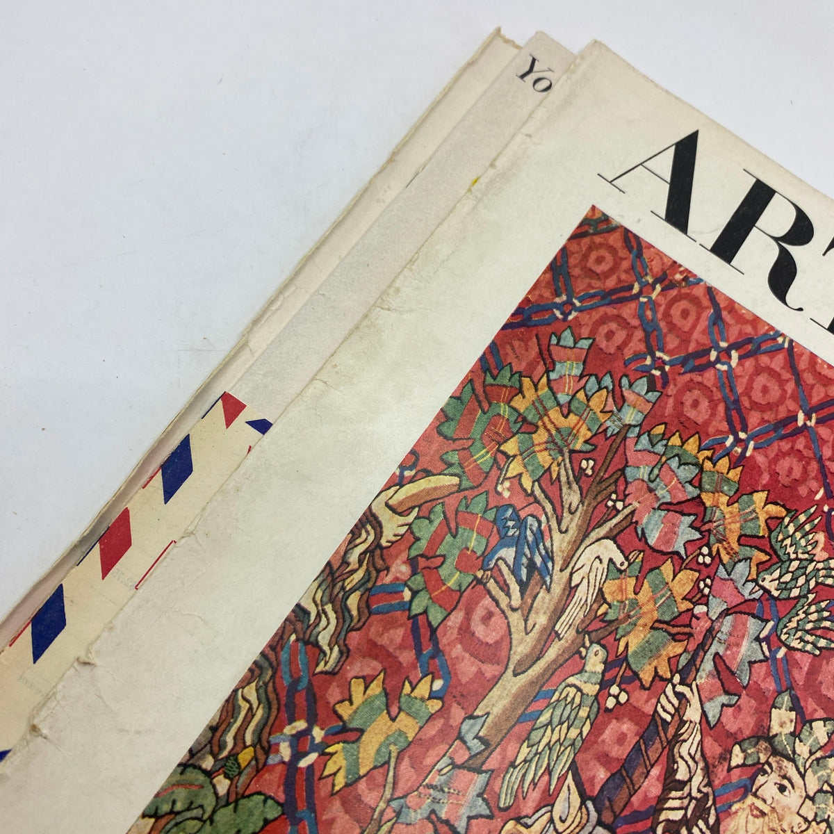 Side view of VTG Art News Magazine December 1955 displaying aging and wear, emphasizing the vintage aspect of the publication.