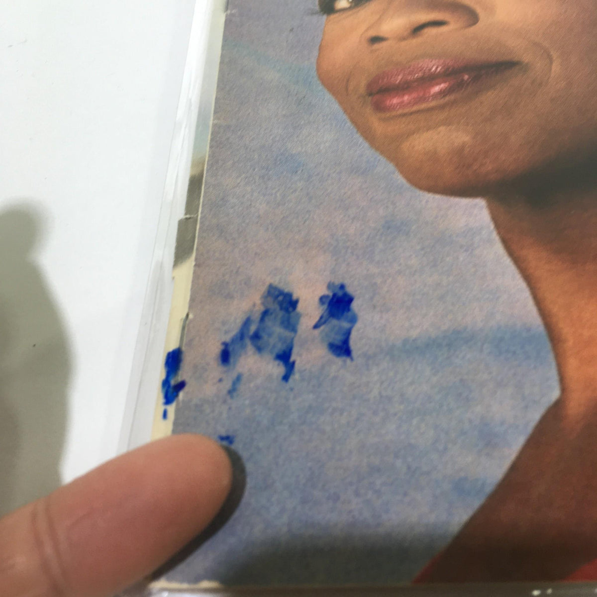 Close-up of the cover of People Magazine dated September 12, 1994, with Oprah Winfrey. The image highlights a blue ink mark on the edge of the magazine cover, alongside Oprah's expression, adding character to this vintage collectible.