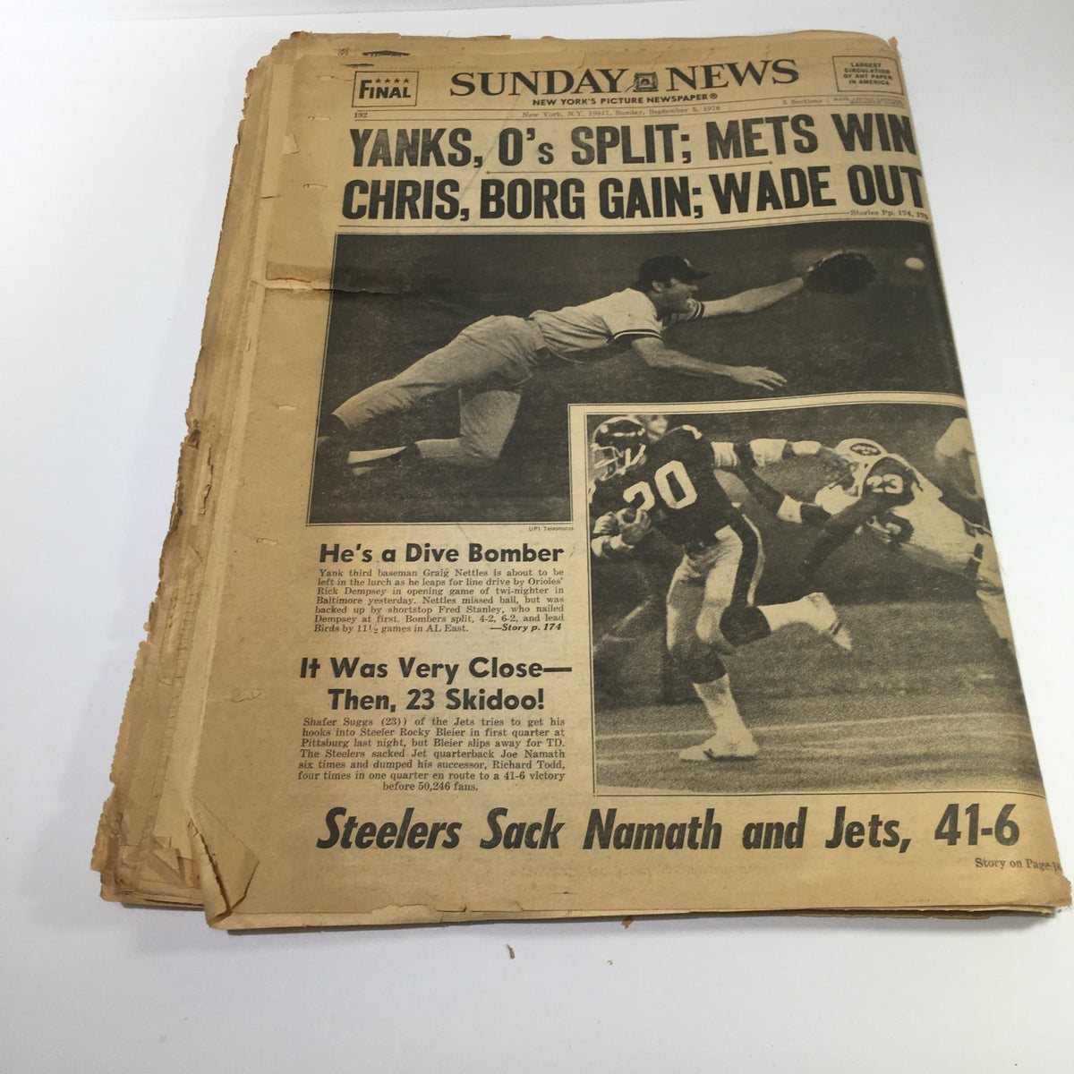 NY Daily News article from 9/5/1976 displaying various headlines including 'Yanks, O's Split; Mets Win' along with sports imagery. The page shows age and preservation condition.