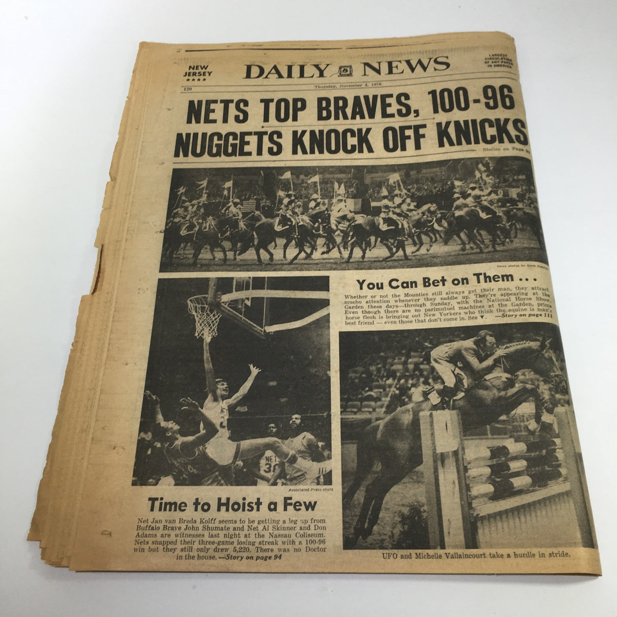 NY Daily News headline featuring 'Nets Top Braves, 100-96 Nuggets Knock Off Knicks', showcasing sports events with images of basketball games and players.