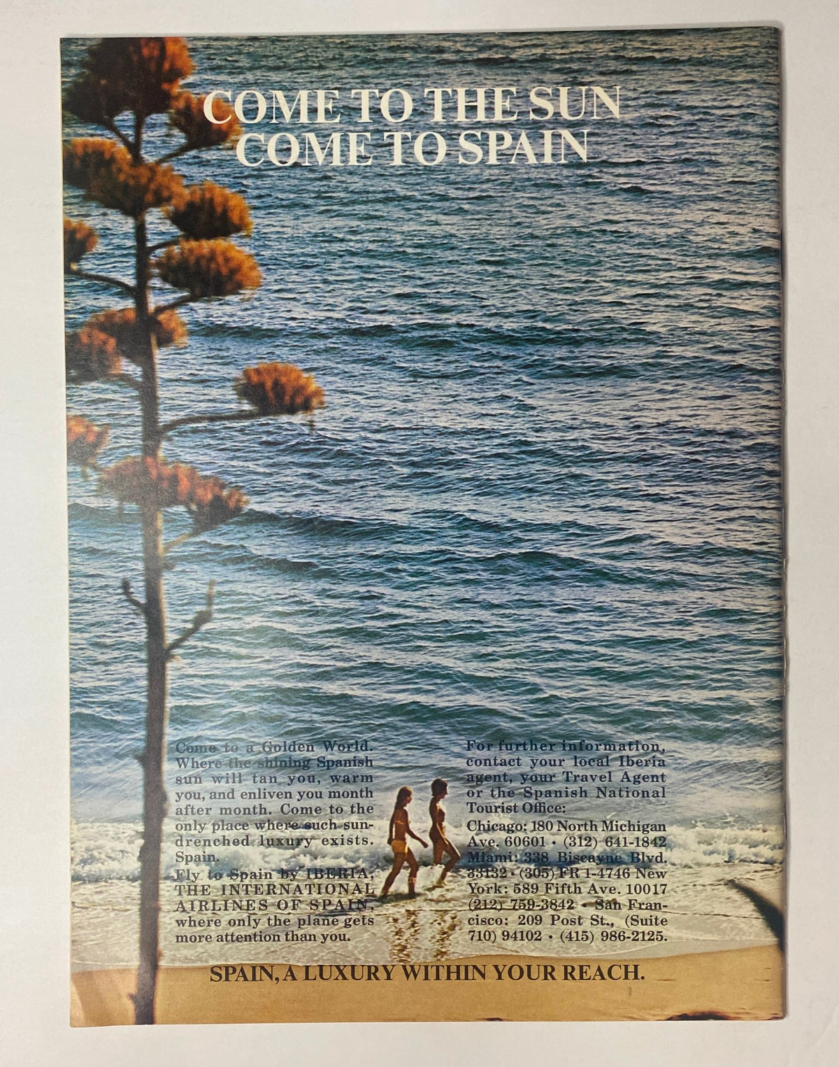 Advertisement for travel to Spain in The New Yorker Full Magazine January 1, 1972, showcasing a beach scene with people walking along the shore.