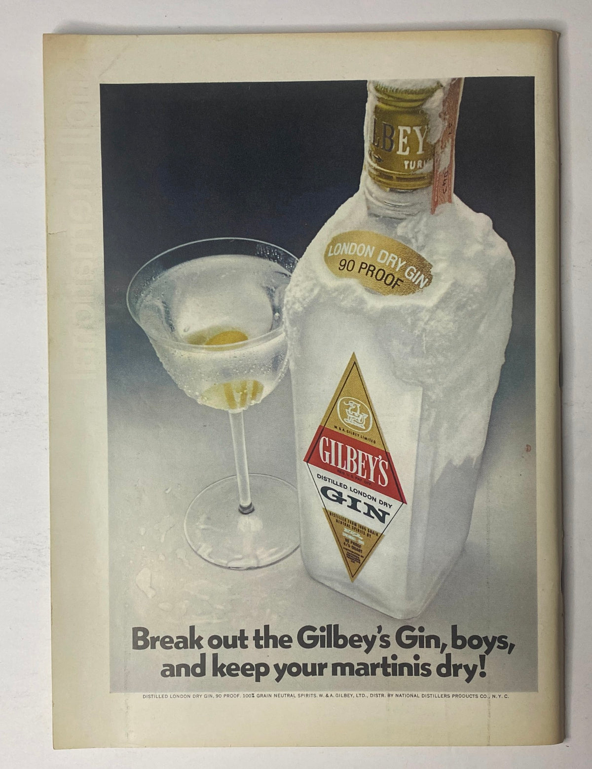 Vintage advertisement for Gilbey's Gin featuring a gin bottle and a martini glass, highlighted with the phrase 'Break out the Gilbey's Gin, boys, and keep your martinis dry!' from The New Yorker Full Magazine March 27, 1971 Saul Steinberg Cover.
