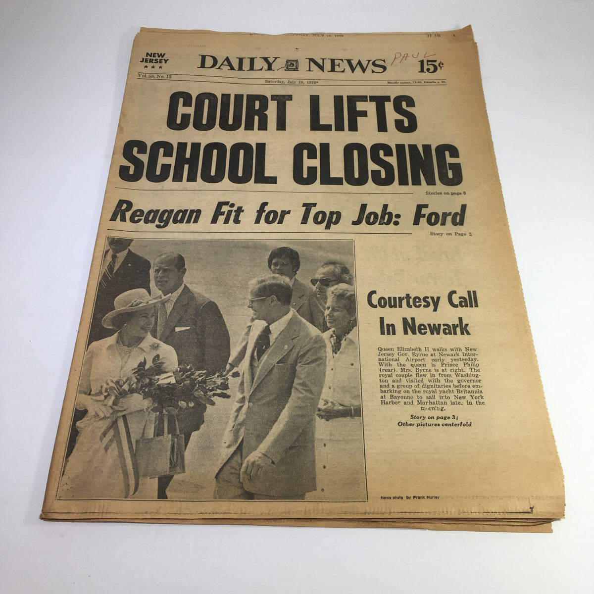NY Daily News headline from July 10, 1976, detailing the court lifting school closings. The article includes a photo of Queen Elizabeth walking with Byrne in Newark.