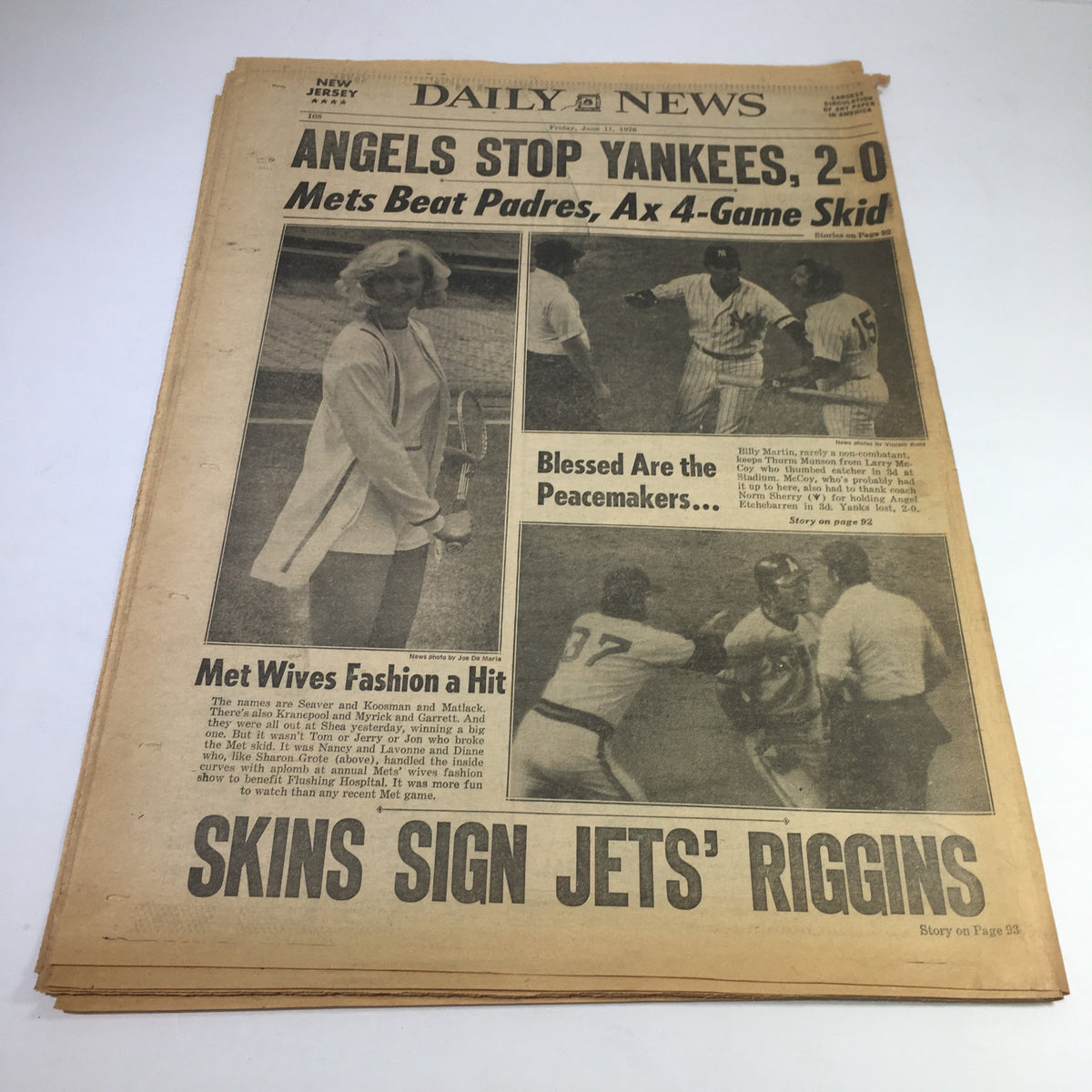 Another vintage newspaper from NY Daily News featuring the headline 'Angels Stop Yankees, 2-0: Mets Beat Padres, Ax 4-Game Skid'. The article highlights significant baseball events and Met wives fashion.