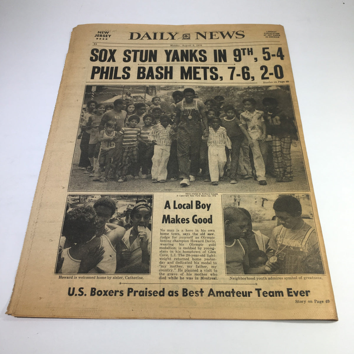 NY Daily News from August 2, 1976, featuring coverage of the tragic flash flood in Colorado that resulted in 63 deaths, showcasing a poignant historic moment with a group of children on the front page.