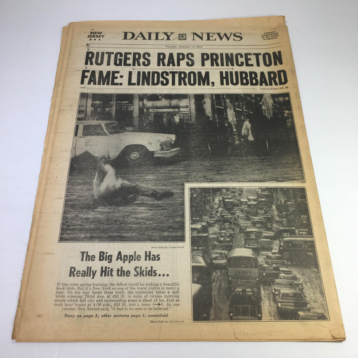 NY Daily News front page from 2/3/1976 featuring the headline 'Moynihan Quits As UN Envoy; NJ Stalls In Icy Winds, Snow' alongside an image of cars in traffic and a Rutgers vs Princeton sports mention.