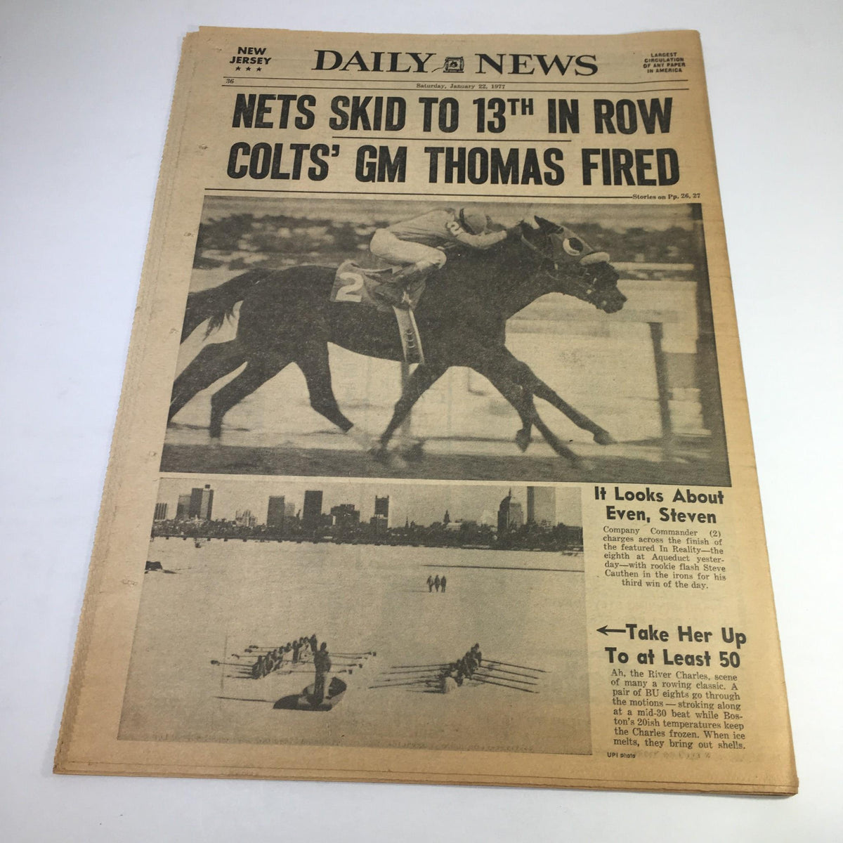 New York Daily News cover featuring the headline 'Nets Skid to 13th in Row Colts' GM Thomas Fired' showcasing an image of a horse race, emphasizing sports news and team management changes.