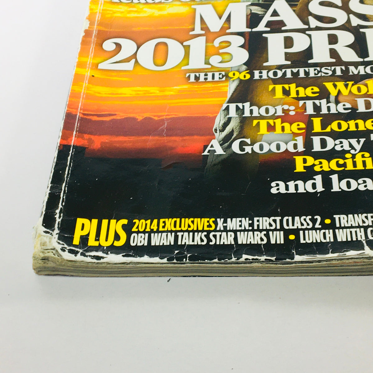Side view of Total Film Magazine February 2013 #202, showing worn edges and details about movies featured in that issue, emphasizing its historical significance.