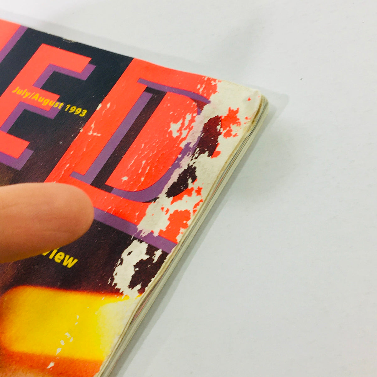 Close-up view of the cover of Wired Magazine July August 1993 Vol 1 #3, highlighting the magazine title and edge wear, indicating its vintage status.