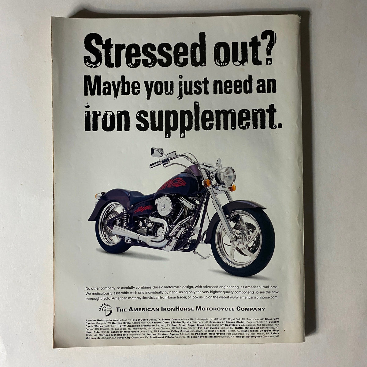 Ad showcasing a custom motorcycle with the headline 'Stressed out? Maybe you just need an iron supplement.' This image is part of the Easyriders Magazine October 1999 issue, featuring Robbie Knievel's Death Jump.