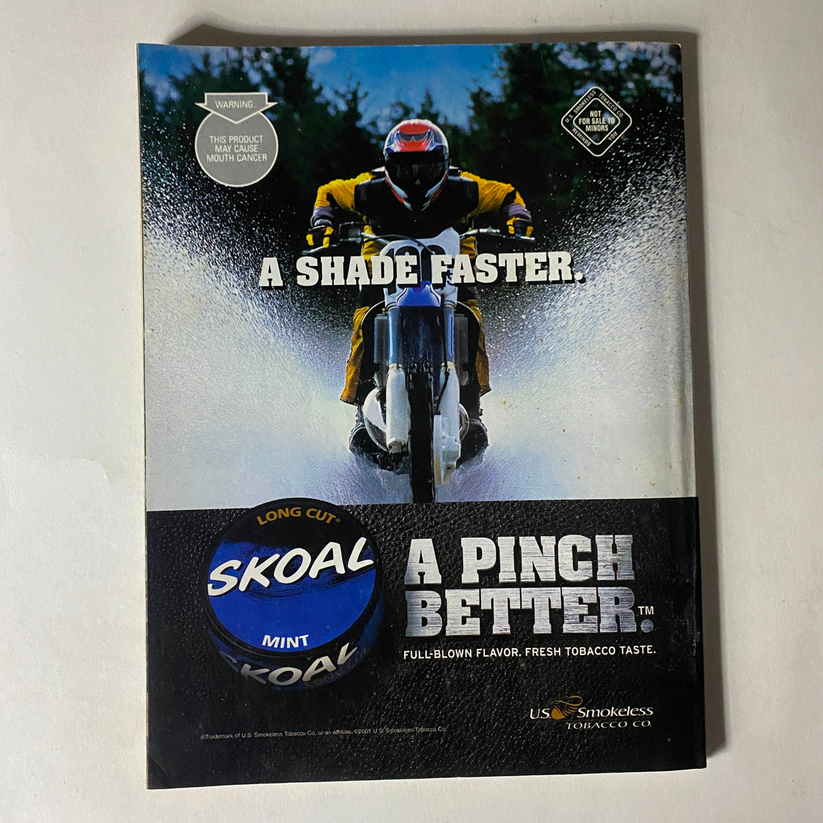 Back cover of Easyriders Magazine November 2001 promoting Skoal tobacco product with a motocross image.