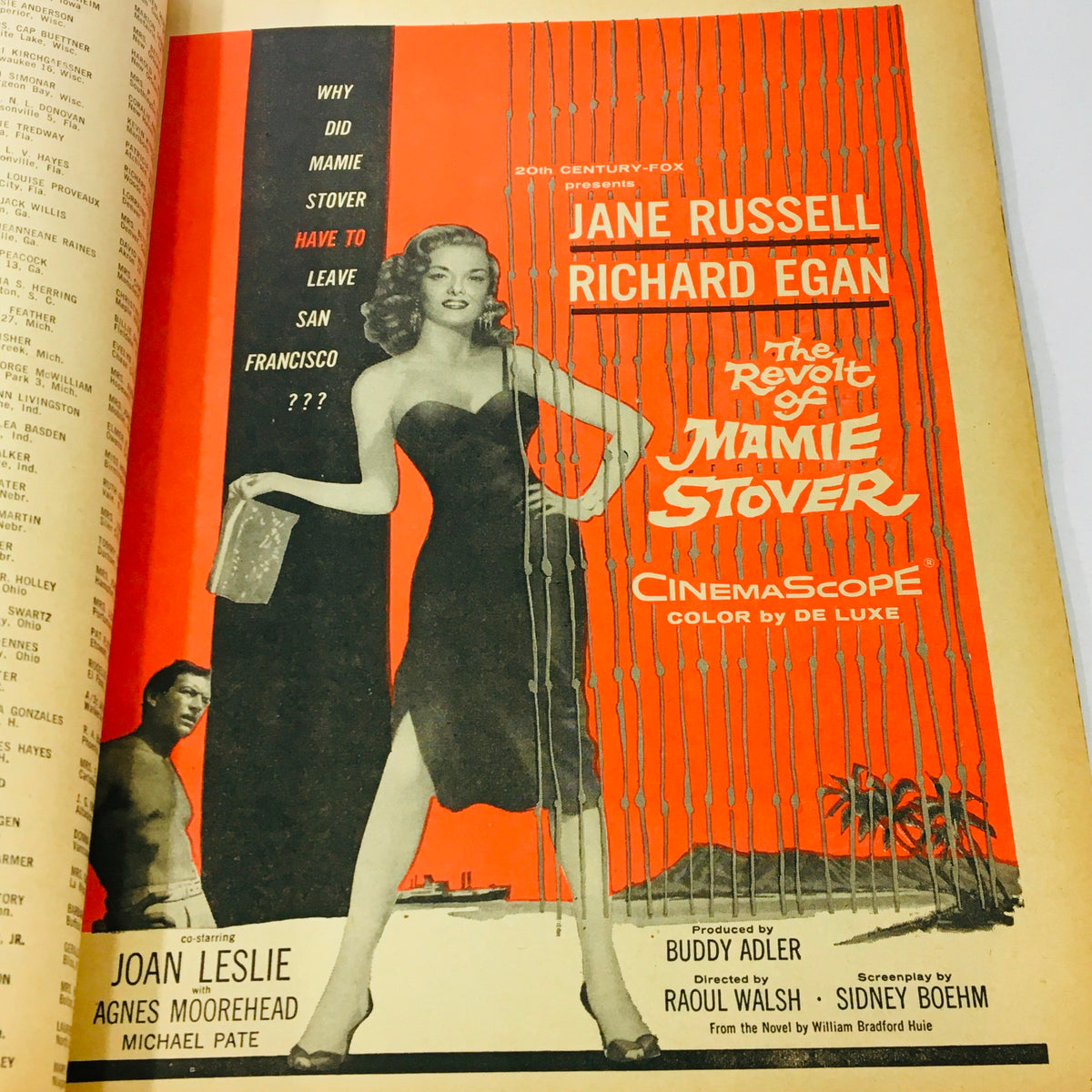 Vibrant advertisement for the movie 'The Revolt of Mamie Stover,' starring Jane Russell, featured inside the May 1956 issue of Modern Screen Magazine.