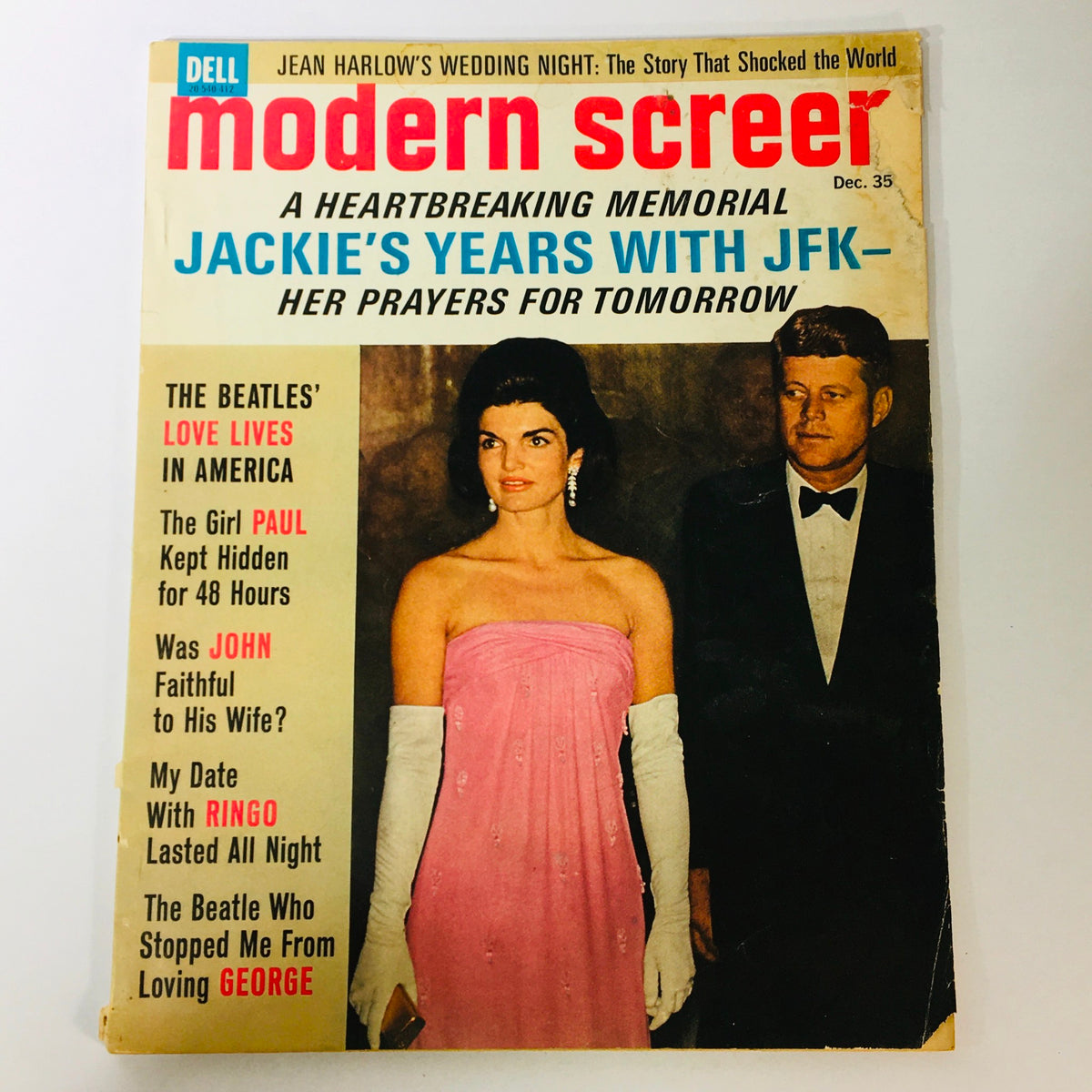 Vintage Modern Screen Magazine cover from December 1964 featuring Jackie Kennedy and John F. Kennedy, highlighting their charismatic presence and significant cultural moment.