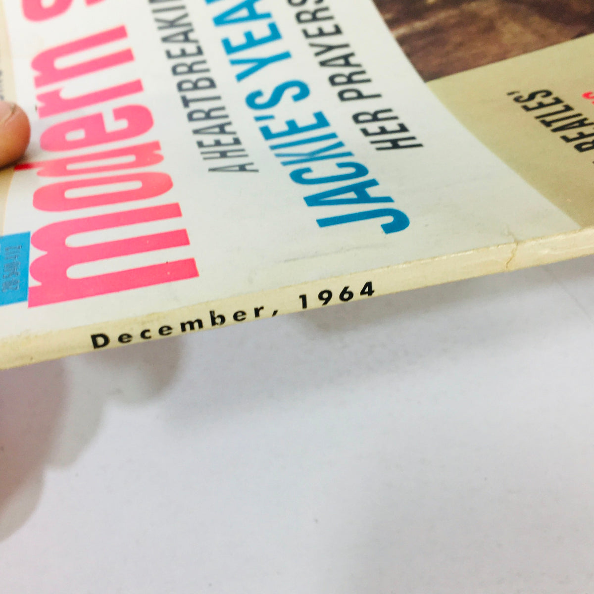 Cover detail of VTG Modern Screen Magazine December 1964 featuring Jackie Kennedy and John F. Kennedy, showcasing the magazine's vintage charm.