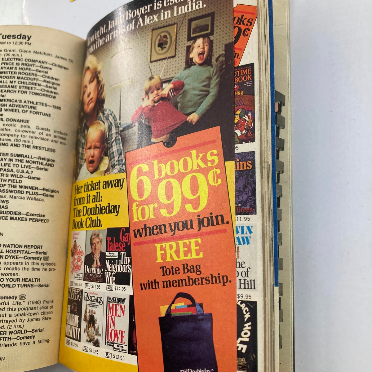 Inside page of TV Guide Magazine July 19, 1980 showcasing an advertisement for the Doubleday Book Club offering 6 books for 99 cents with a free tote bag for members, alongside images of previous magazine issues.