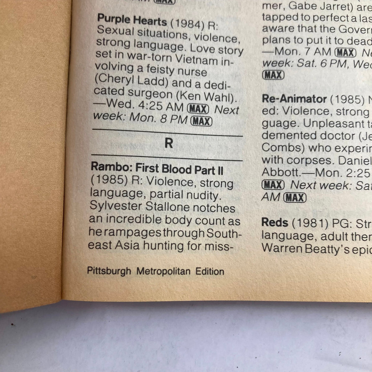 Inside page of TV Guide Magazine June 13, 1987 displaying movie listings including 'Rambo: First Blood Part II' and 'Purple Hearts', from Pittsburgh Metropolitan Edition.