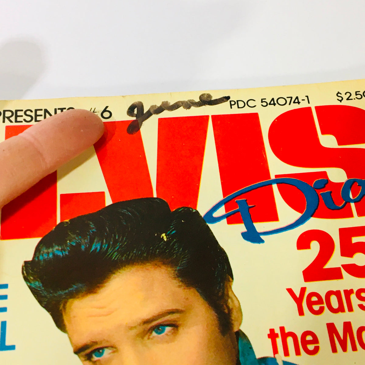 Close-up of the Platinum Presents 1979 #6 Elvis Presley Diary, highlighting a handwritten mark indicating 'June' near the title, emphasizing its authenticity and collector's value.