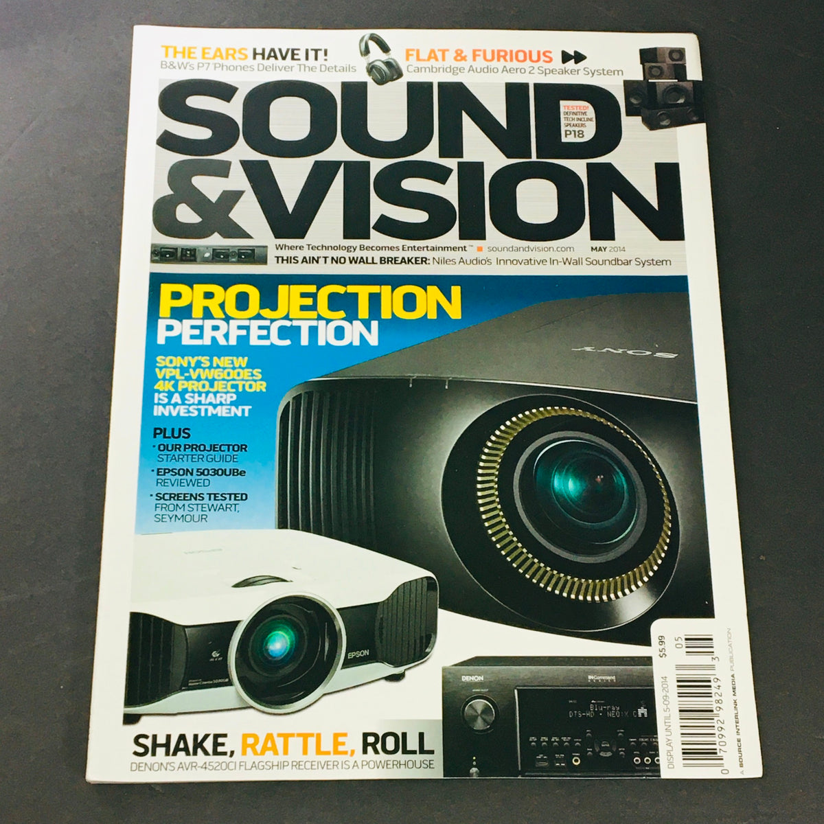 Cover of Sound & Vision Magazine May 2014 featuring the Sony VPL-VW600ES Projector, showcasing a sleek projector design and headline on projection technology advancements.