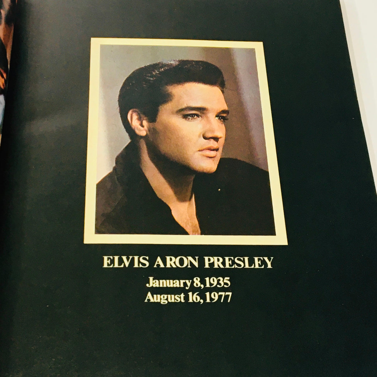 Inside page from VTG 1977 Elvis Aron Presley A Photoplay Tribute showing a portrait of Elvis Presley with his birth and death dates, January 8, 1935 - August 16, 1977.