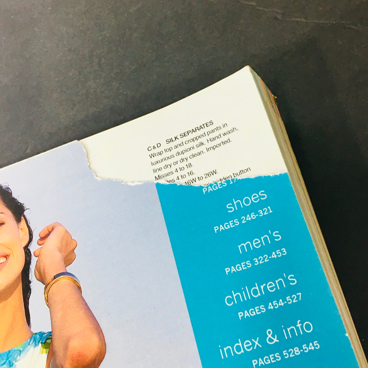 Top view of an open JC Penney Spring Summer 2002 Store Catalog highlighting product information and page details; captures nostalgic fashion trends from the early 2000s.