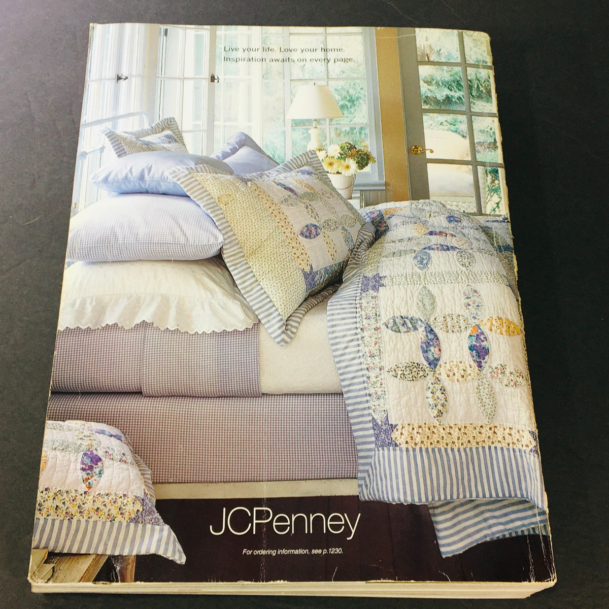 JC Penney Spring Summer 2002 Store Catalog cover displaying a beautifully arranged bedroom with quilted bedding and decorative pillows, capturing the essence of early 2000s home decor.